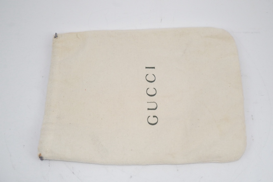 Three vintage Gucci handbags, two canvas blue GG monogram and the other black leather